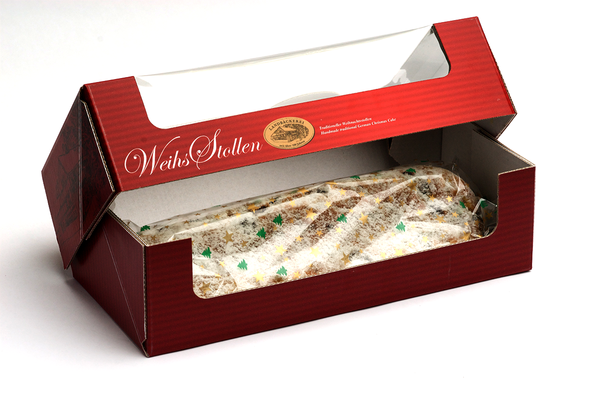 Rot bedruckter Karton mit Weihs-Logo und Sichtfenster, in dem der in Klarsichtfolie verpackte Stollen liegt.